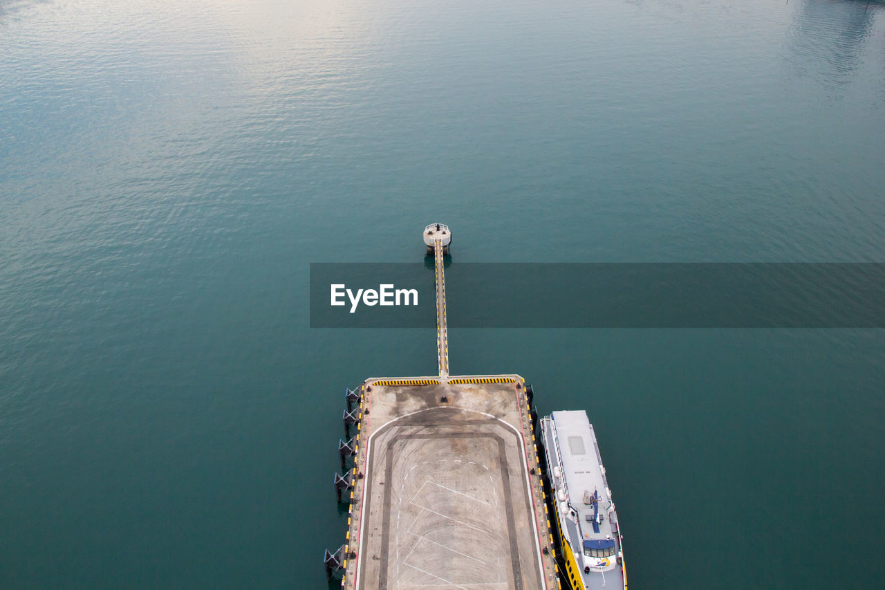 HIGH ANGLE VIEW OF PIER ON SEA AGAINST SKY