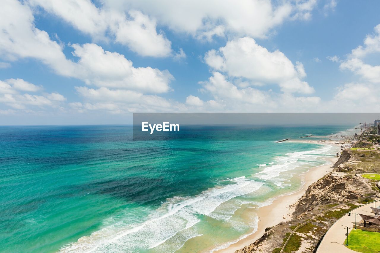 Scenic view of sea against cloudy sky