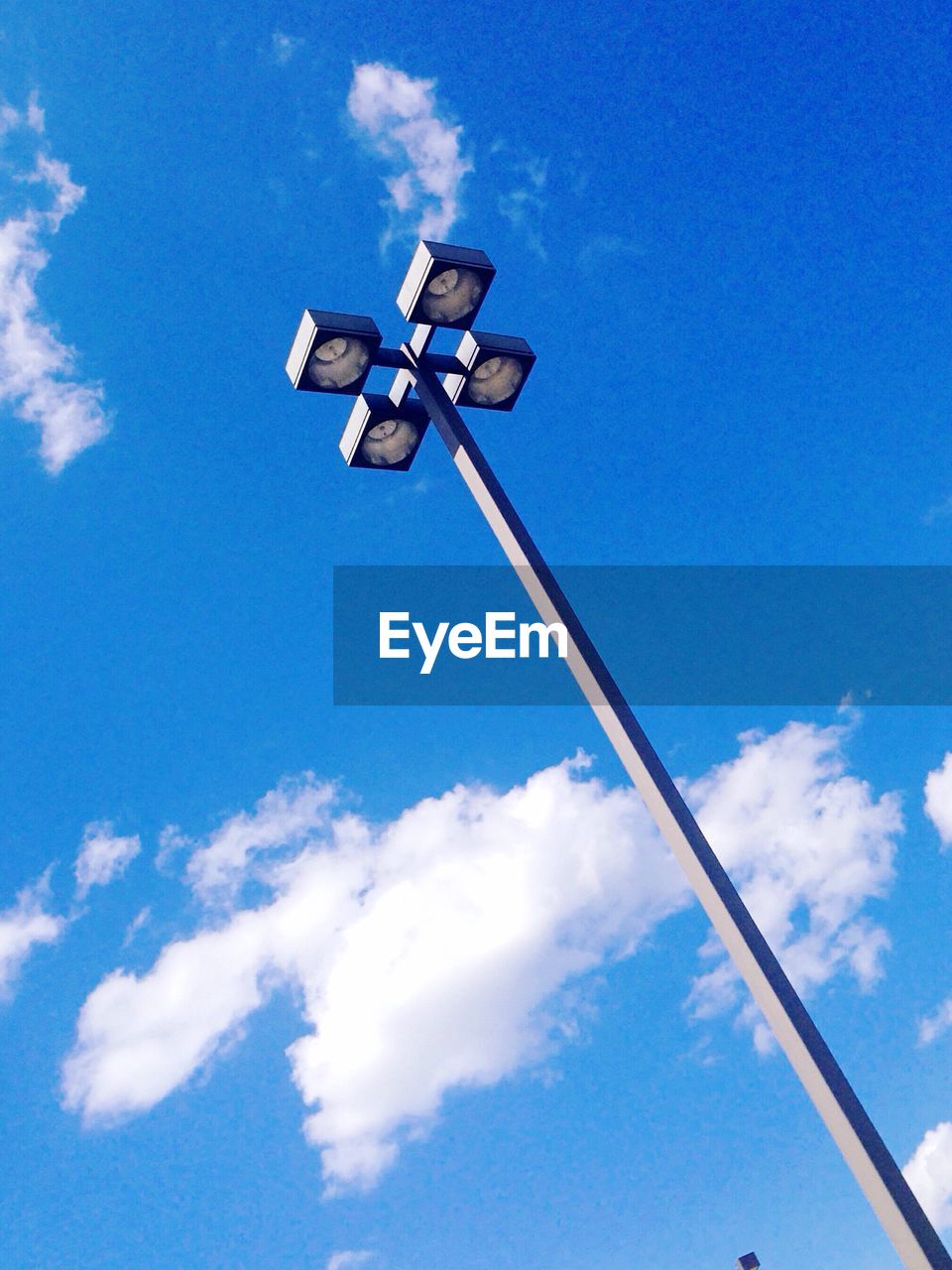 blue, cloud - sky, sky, low angle view, safety, security camera, protection, day, no people, security system, outdoors