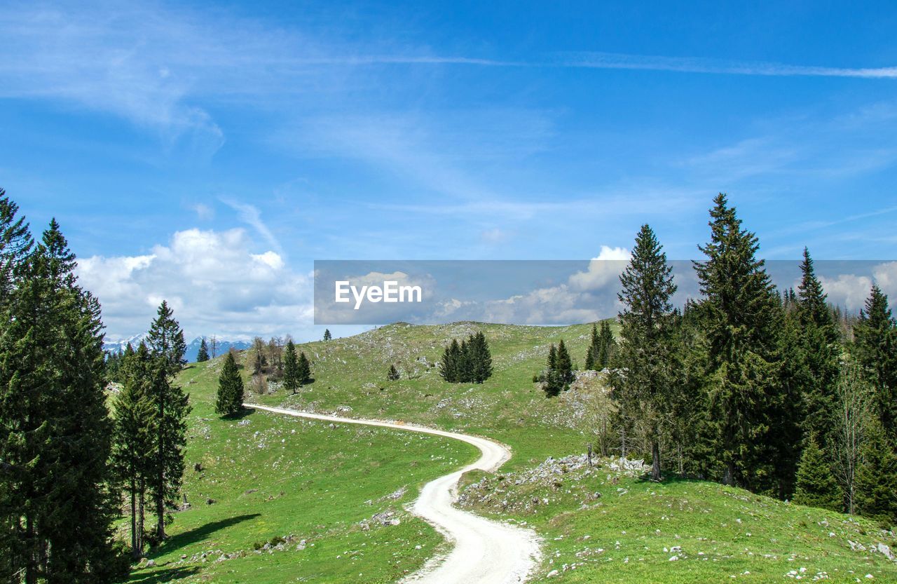 Scenic view of landscape against cloudy sky