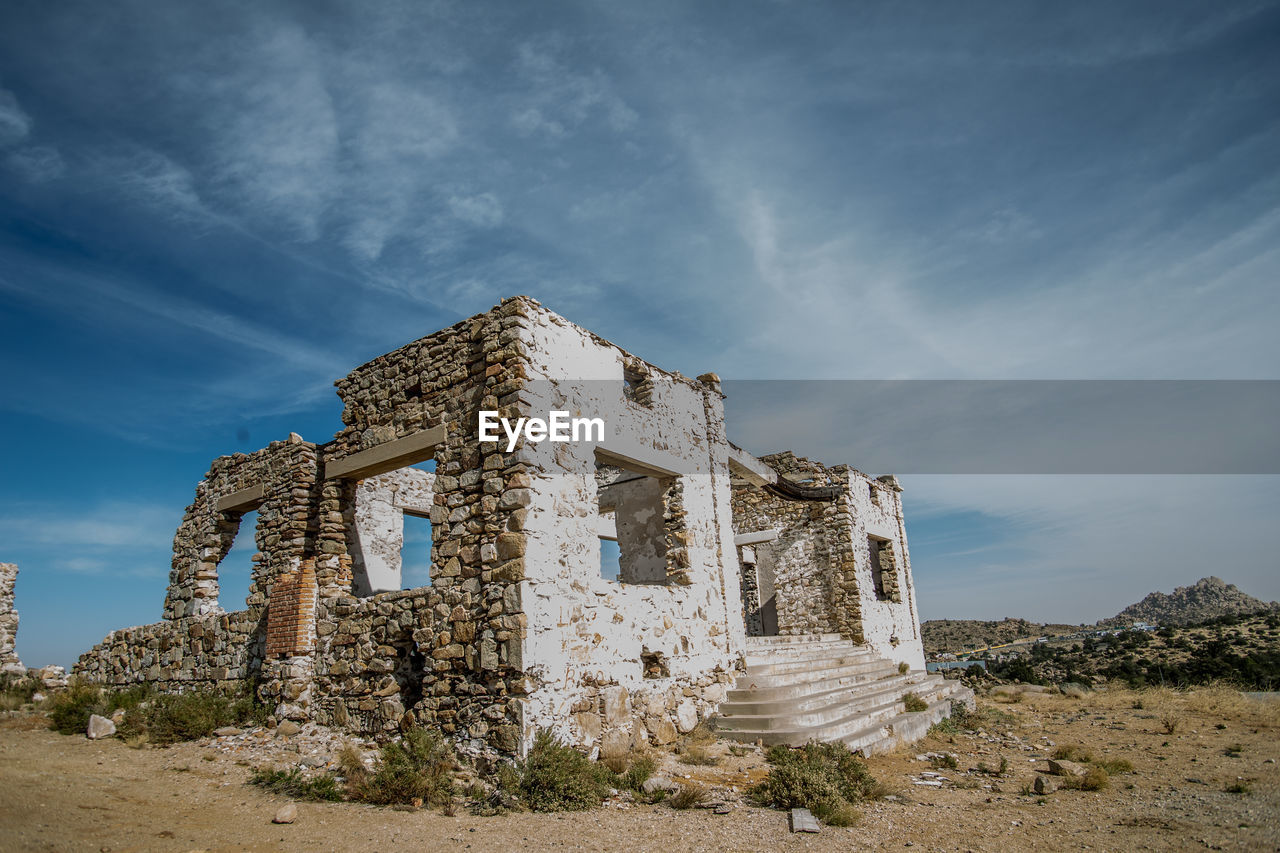 Low angle view of old ruin against sky