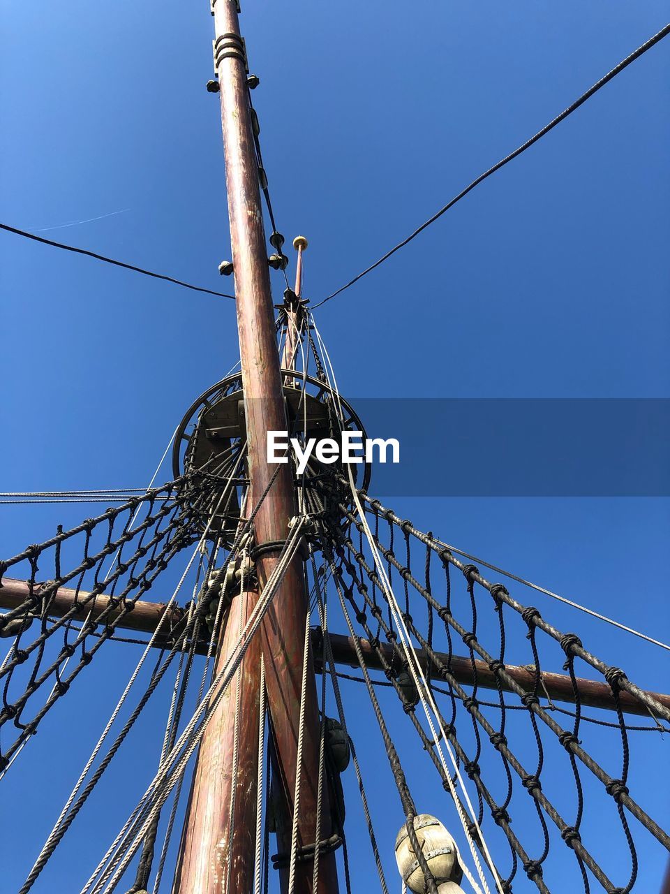 Low angle view of pirates boat against blue sky