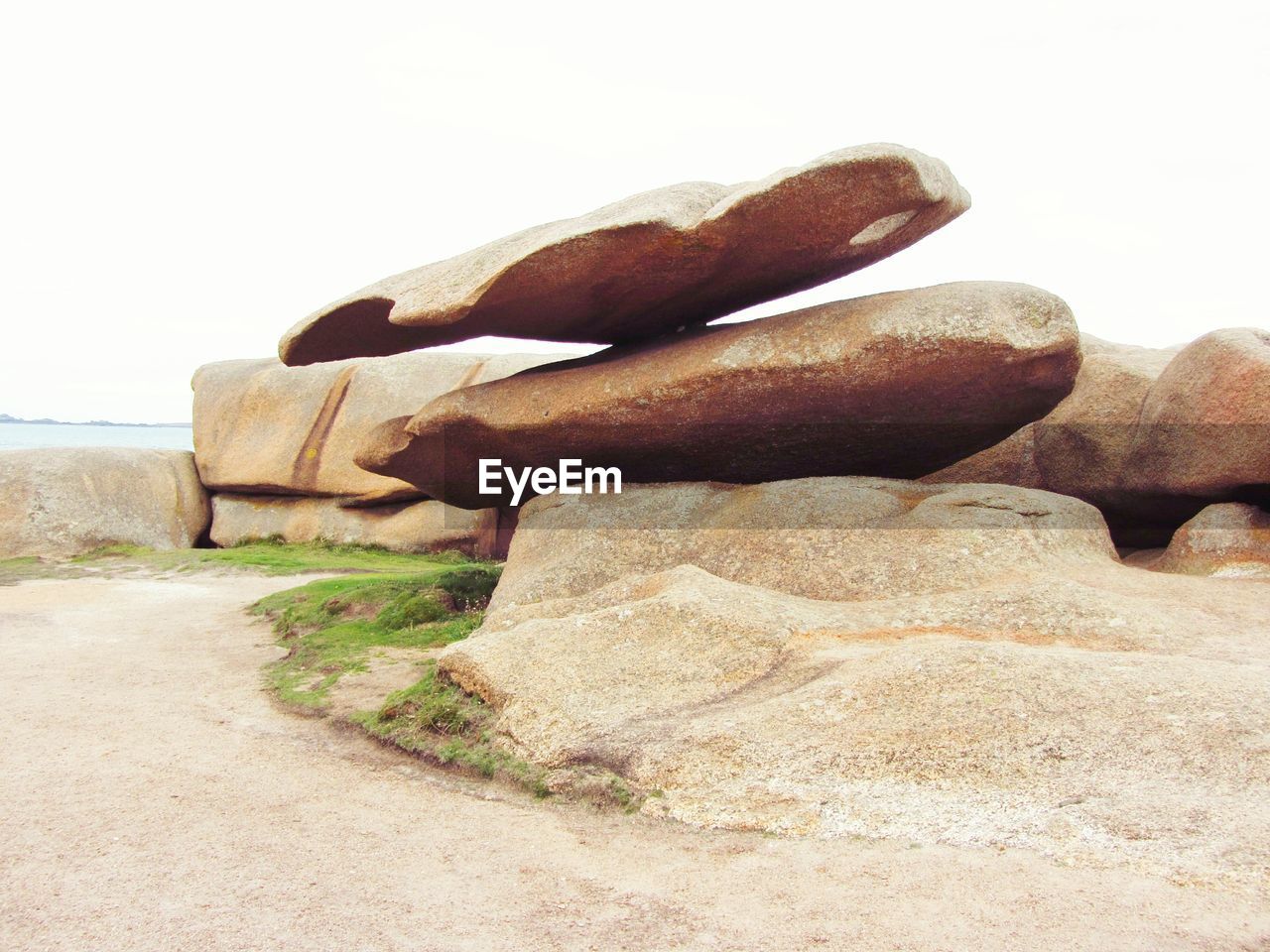 Close-up of stone stack on sand