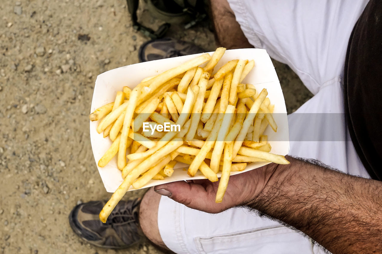 Man holding fries