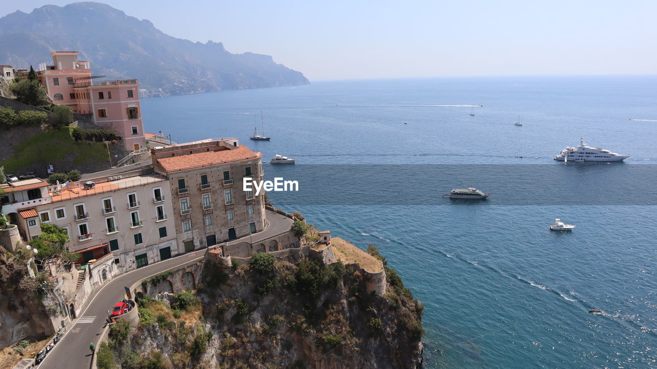 HIGH ANGLE VIEW OF TOWN BY SEA