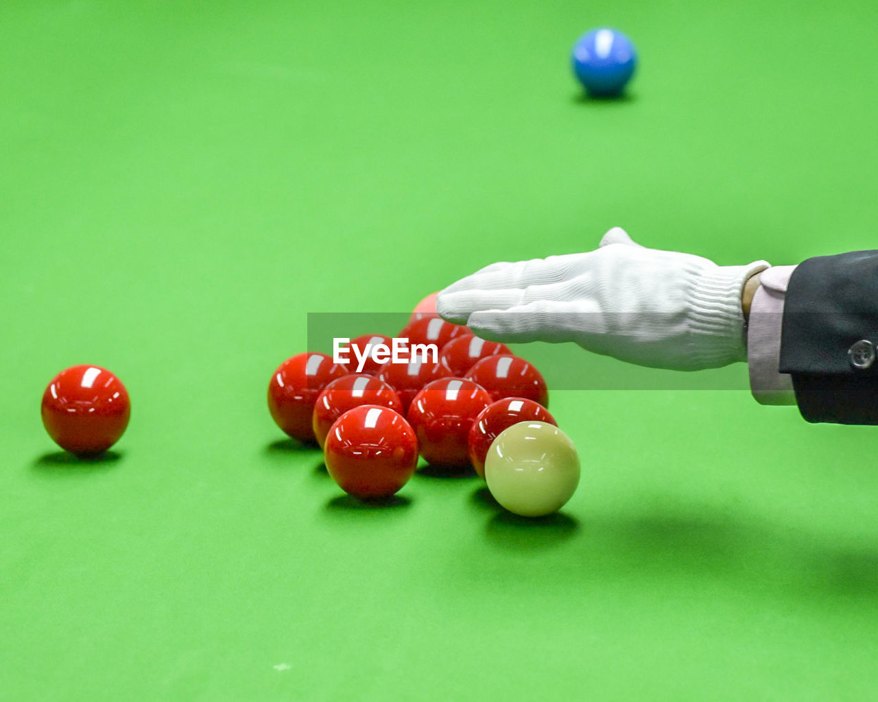 MIDSECTION OF PERSON PLAYING WITH BALL AND TABLE