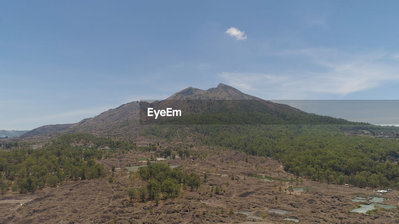 VIEW OF VOLCANIC MOUNTAIN AGAINST SKY