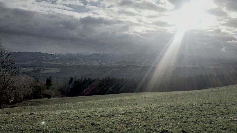 SCENIC VIEW OF MOUNTAINS AGAINST CLOUDY SKY