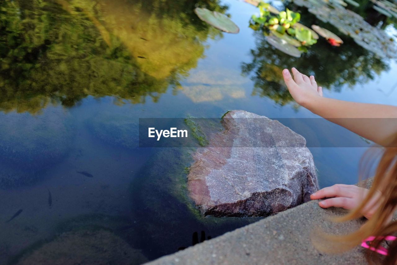 Close-up of woman by lake