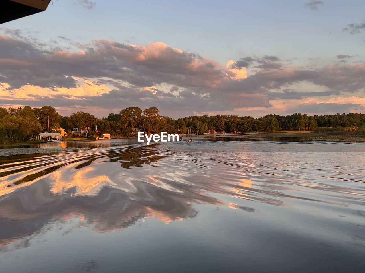 reflection, morning, sky, cloud, water, sunlight, dawn, nature, sunrise, environment, landscape, beauty in nature, horizon, scenics - nature, architecture, no people, mountain, travel, travel destinations, outdoors, tranquility, building, built structure, lake, dramatic sky, sun, land, city, building exterior, tranquil scene