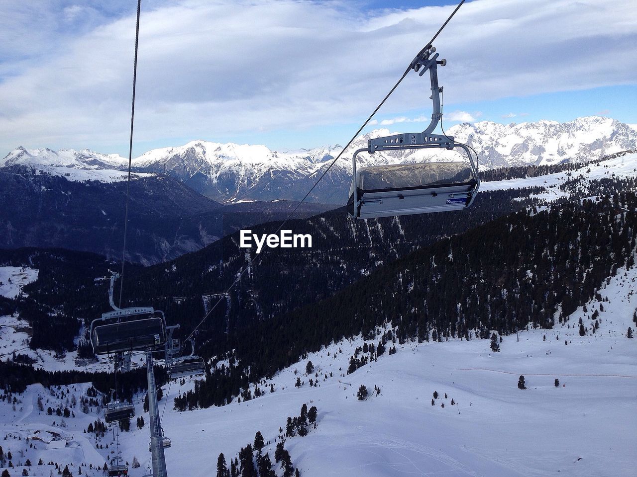 Overhead cable cars over snow covered landscape