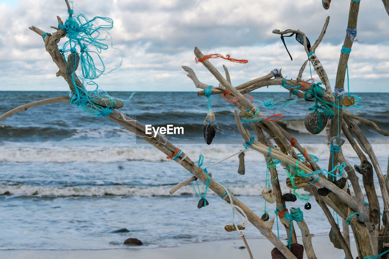 A composition of sticks and stones. installation on the seashore.