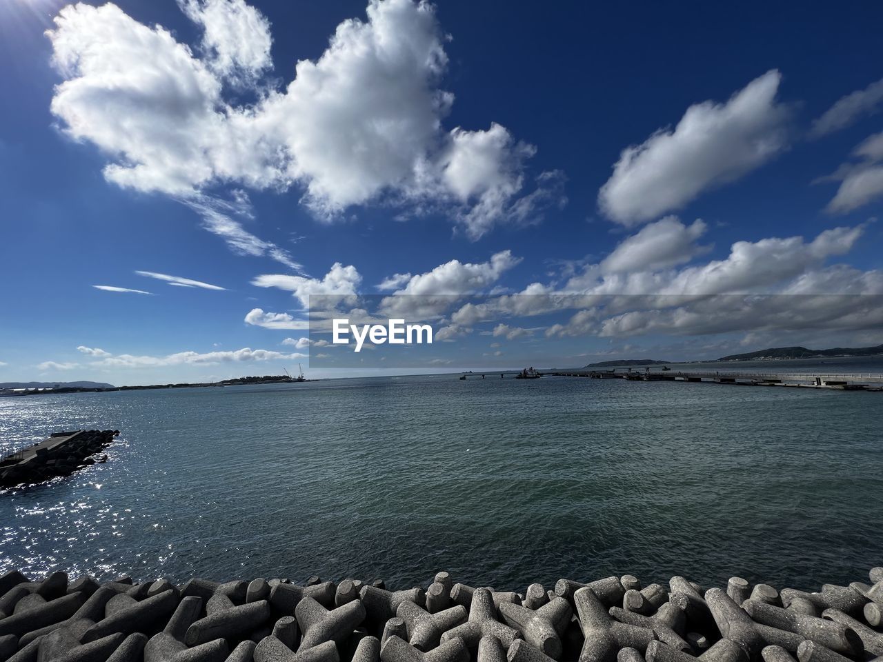 sky, water, horizon, cloud, sea, ocean, shore, coast, scenics - nature, nature, land, beauty in nature, body of water, beach, tranquility, environment, wave, travel destinations, tranquil scene, travel, blue, landscape, no people, rock, outdoors, day, bay, reflection, tourism, coastline, dusk, horizon over water, holiday, seascape, sunlight
