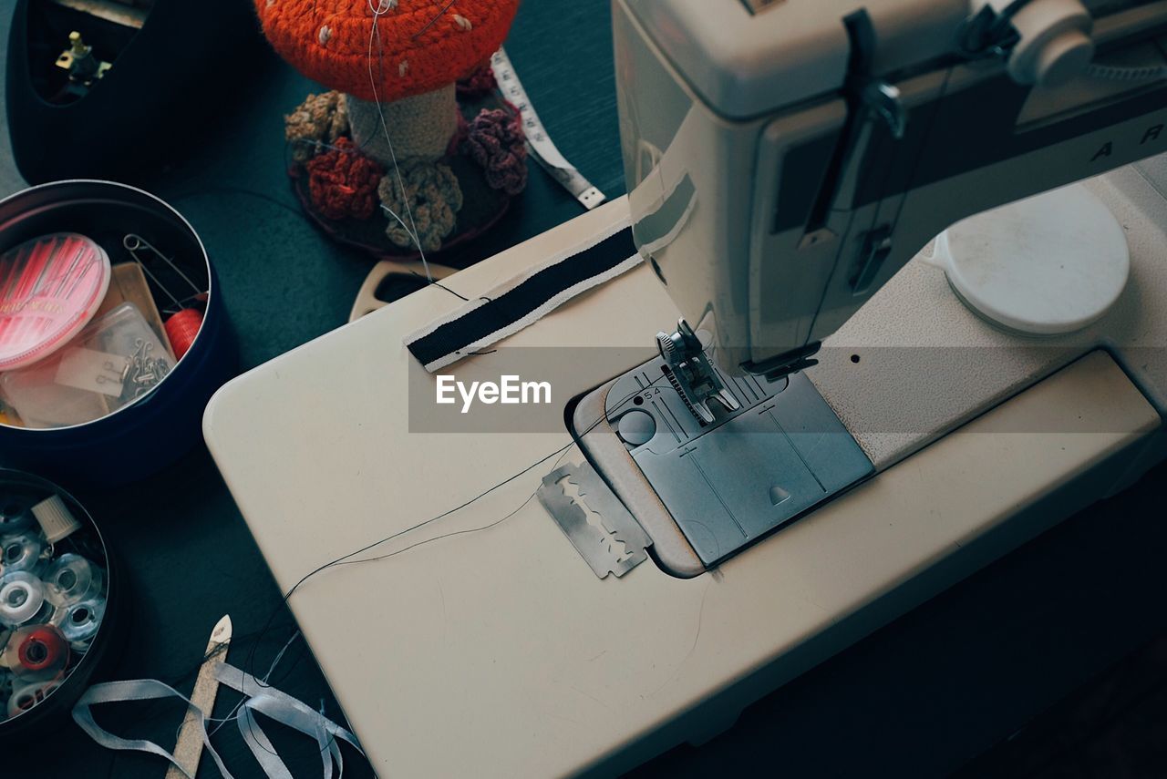 High angle view of sewing machine on table