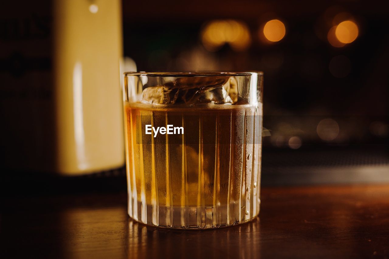 Close-up of whiskey in glass on table