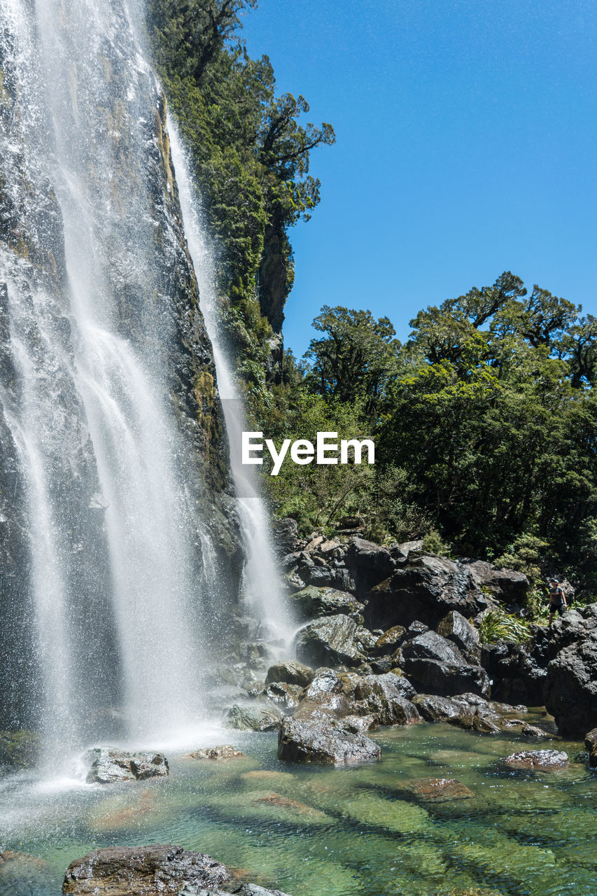 Scenic view of earland falls waterfall against clear sky