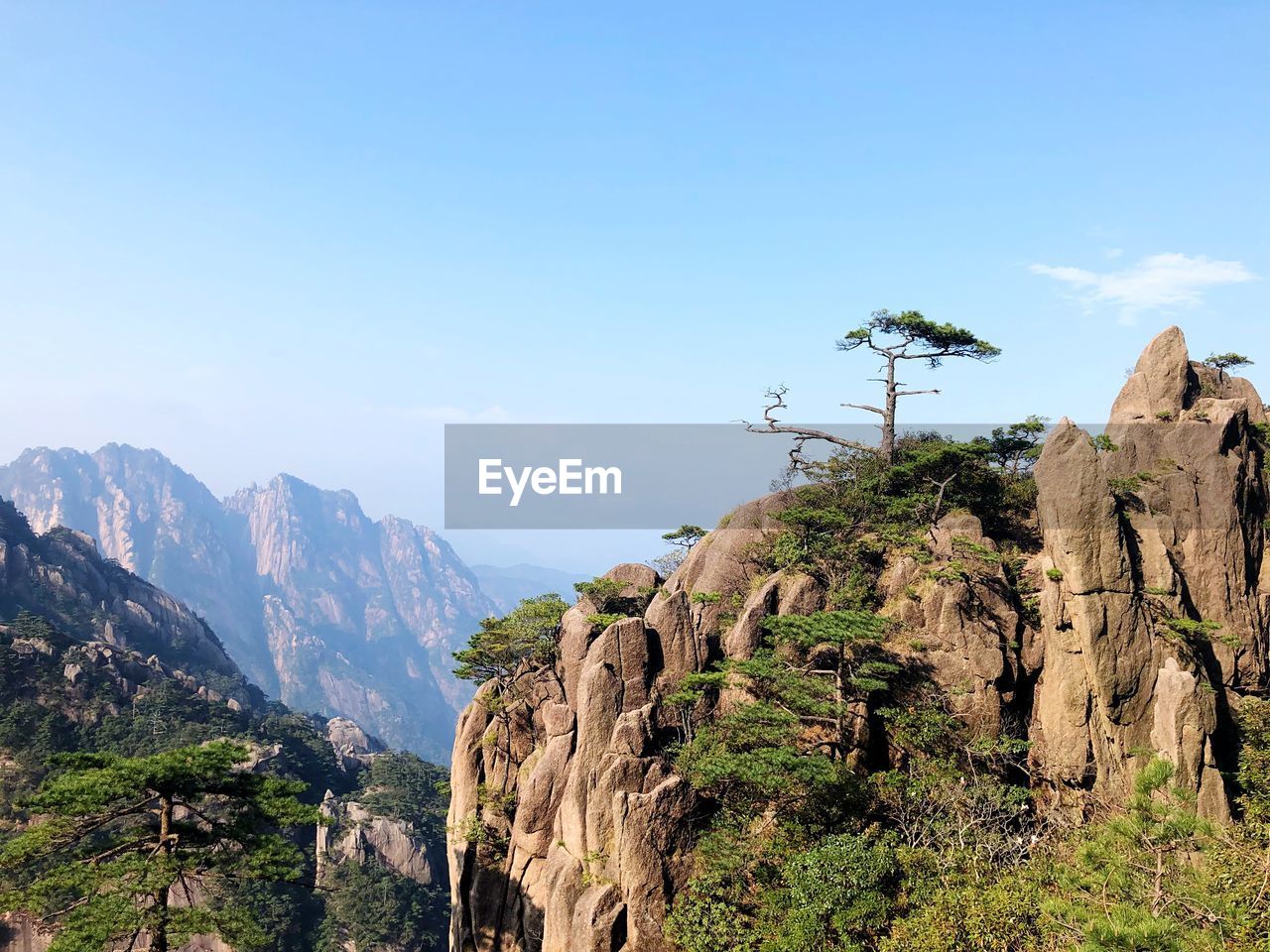 Scenic view of rocky mountains against clear sky