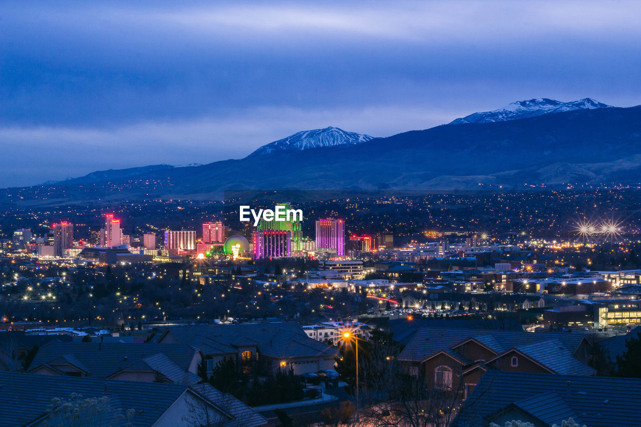 High angle view of illuminated buildings in city at night