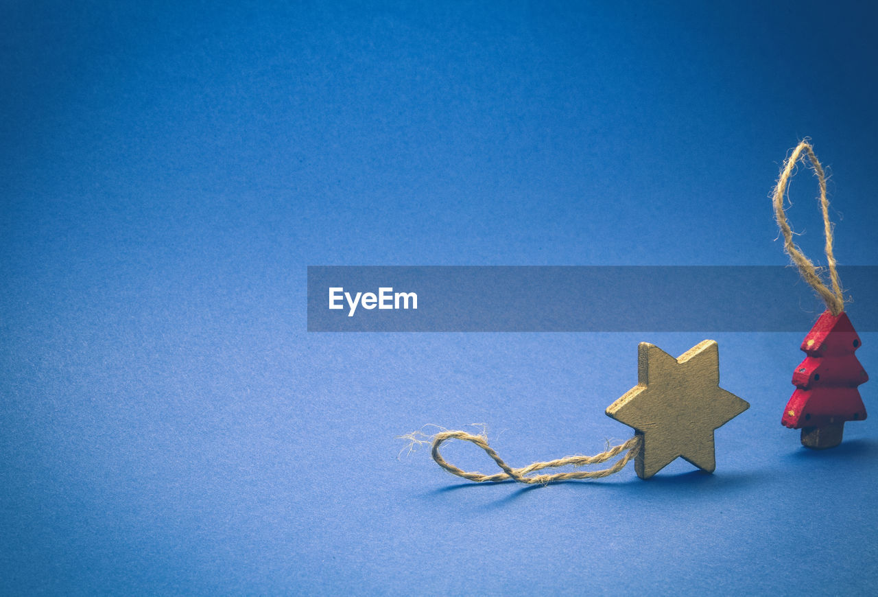 Close-up of christmas decoration against blue background