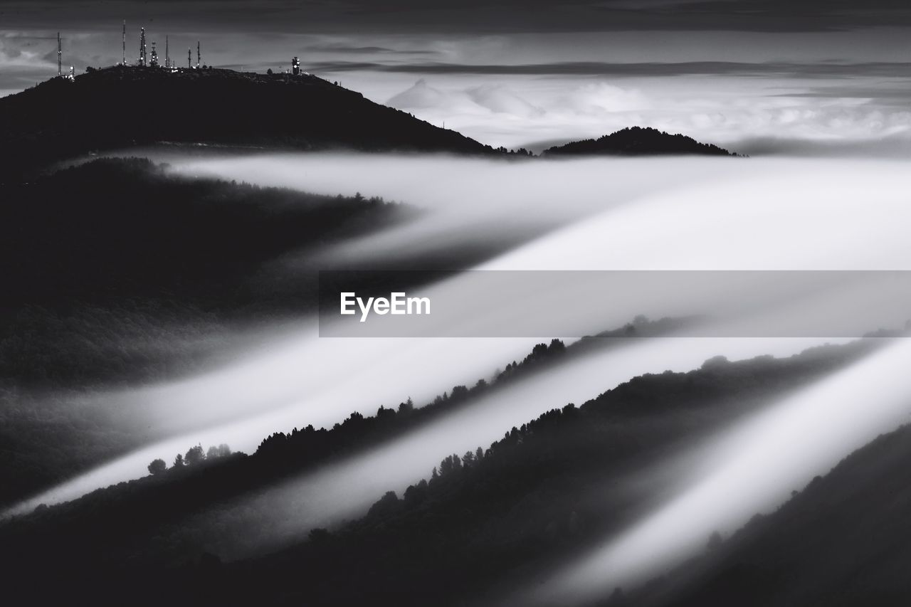 Scenic view of silhouette mountains against sky