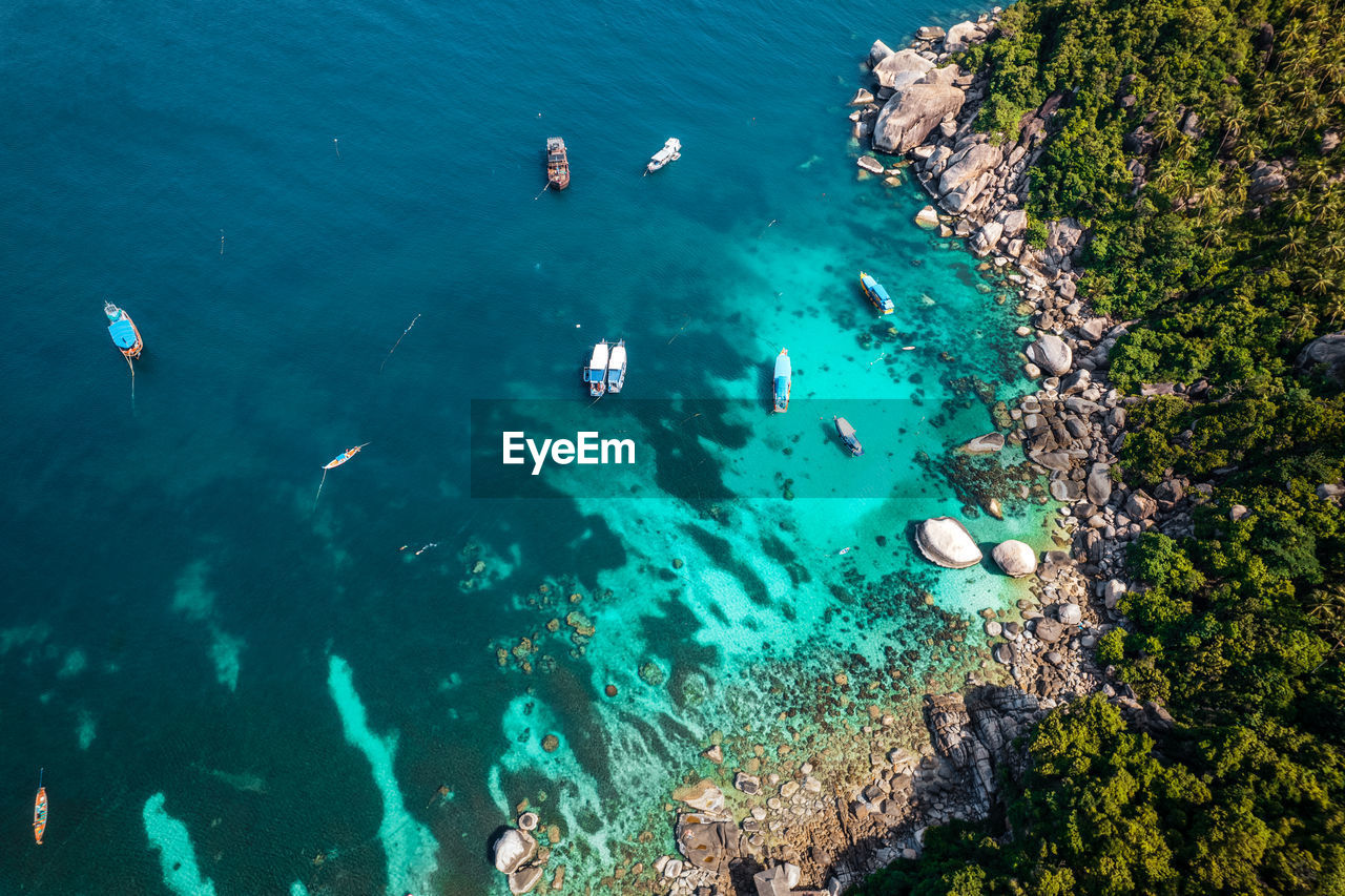 high angle view of rocks in sea