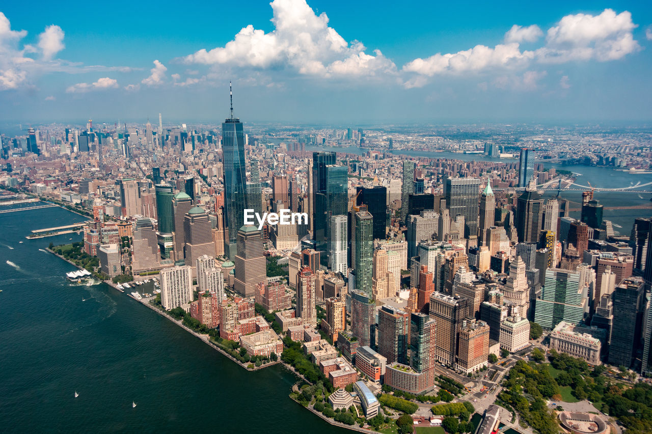 High angle view of buildings against cloudy sky