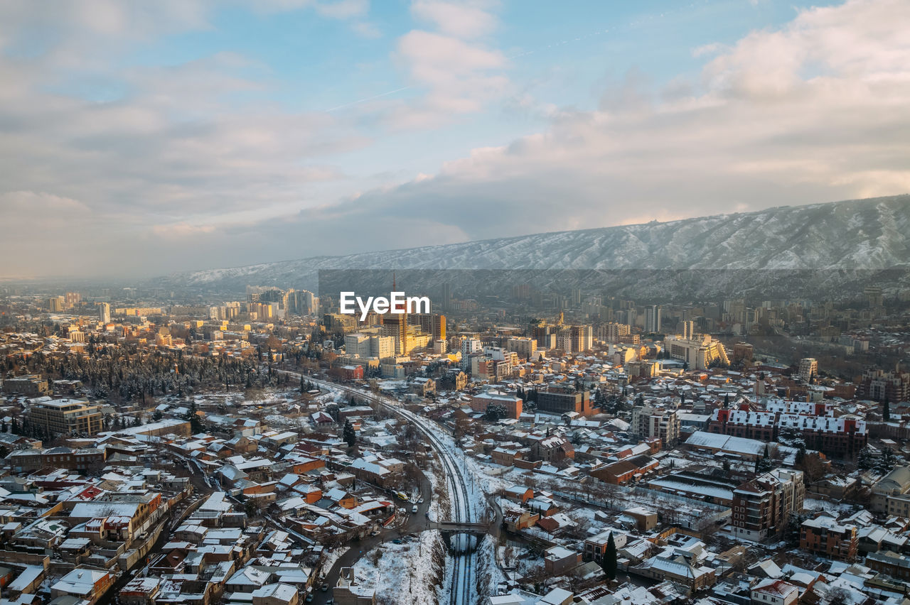 high angle view of cityscape against sky during sunset