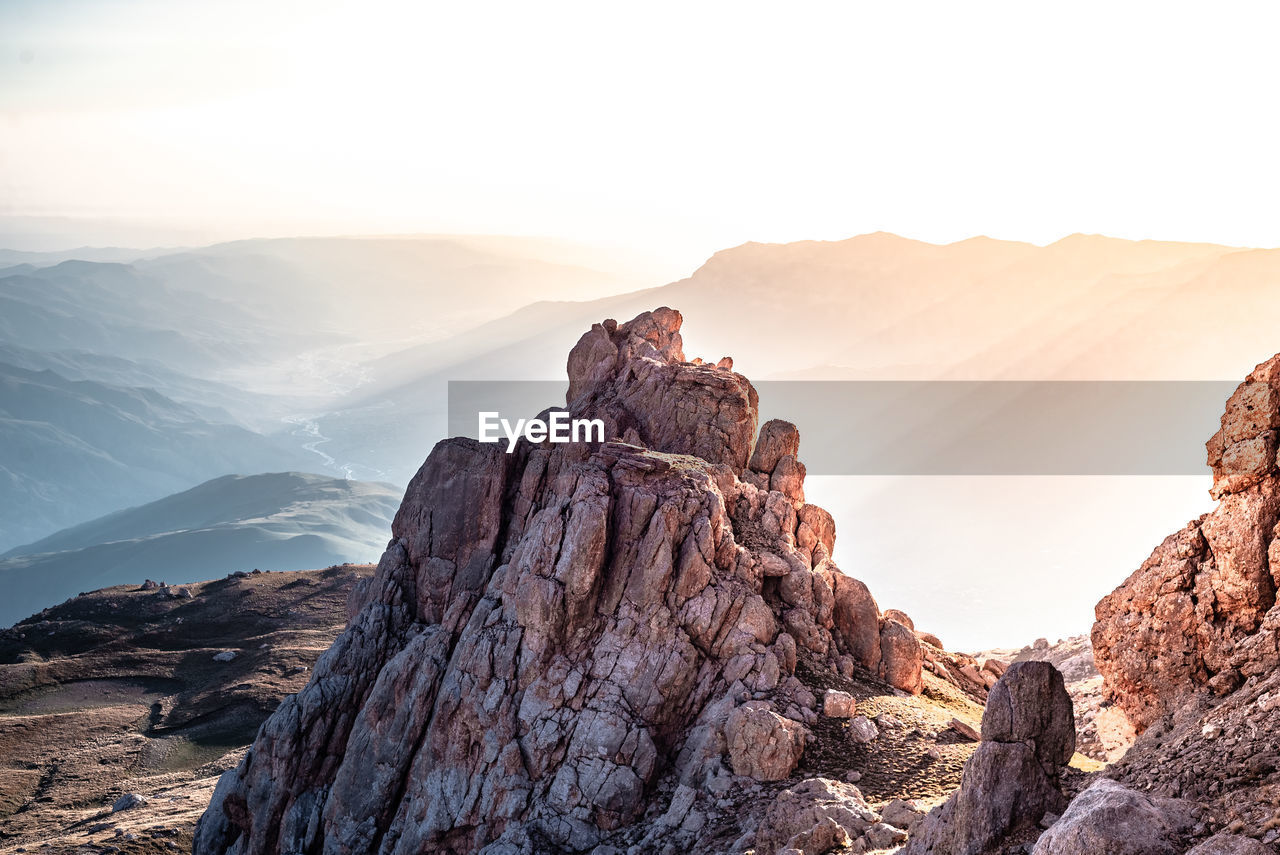 Panoramic view of rock formations against sky