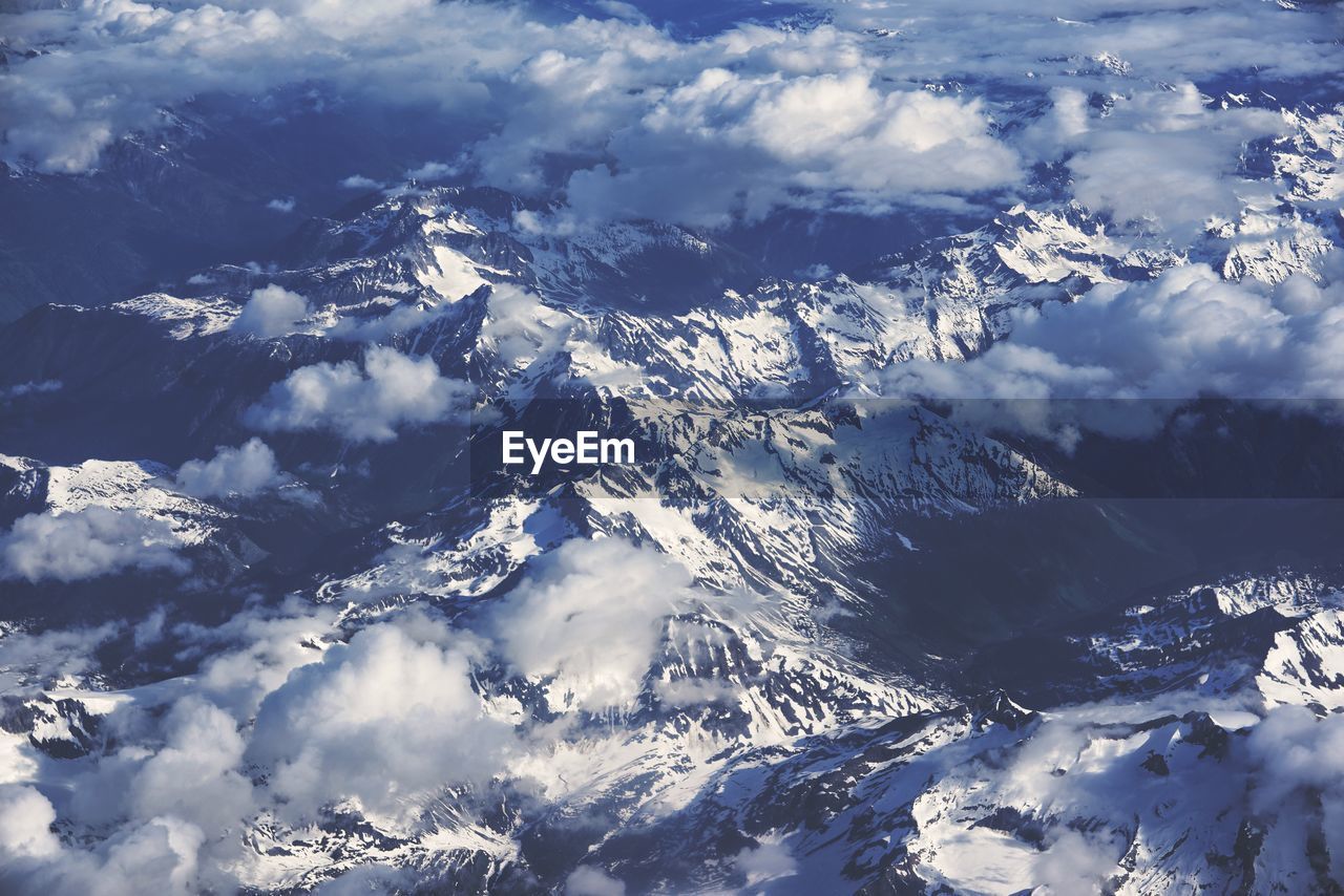 AERIAL VIEW OF SNOWCAPPED MOUNTAIN