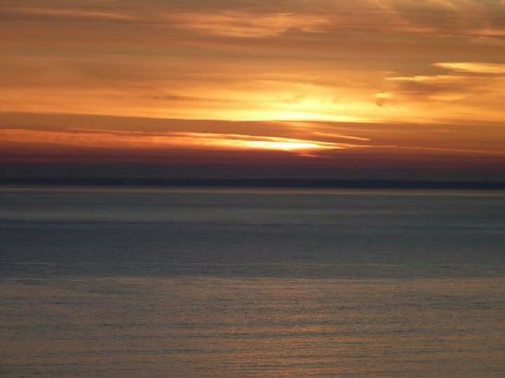 VIEW OF SUNSET OVER SEA