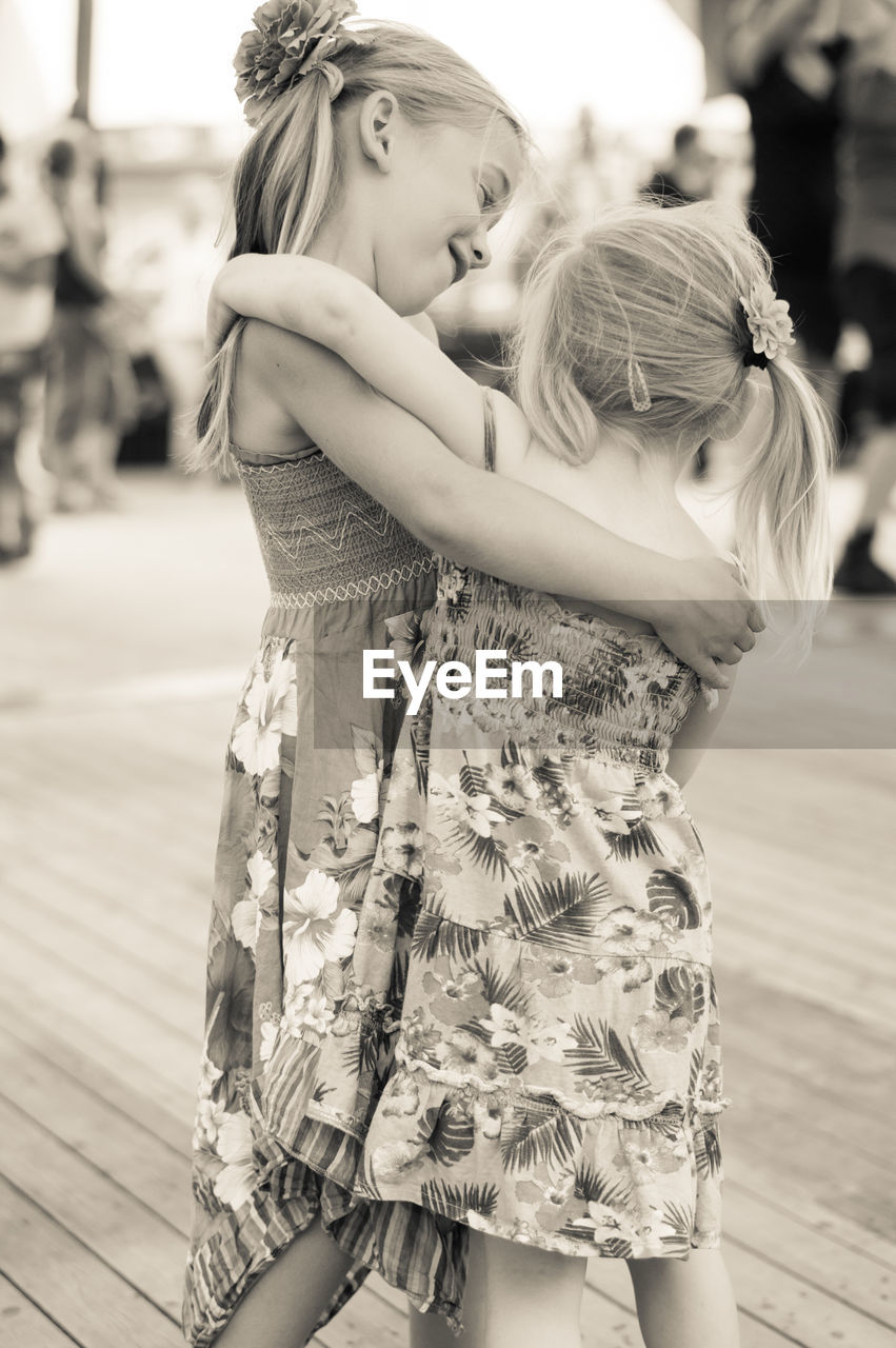 Girl dancing with sister