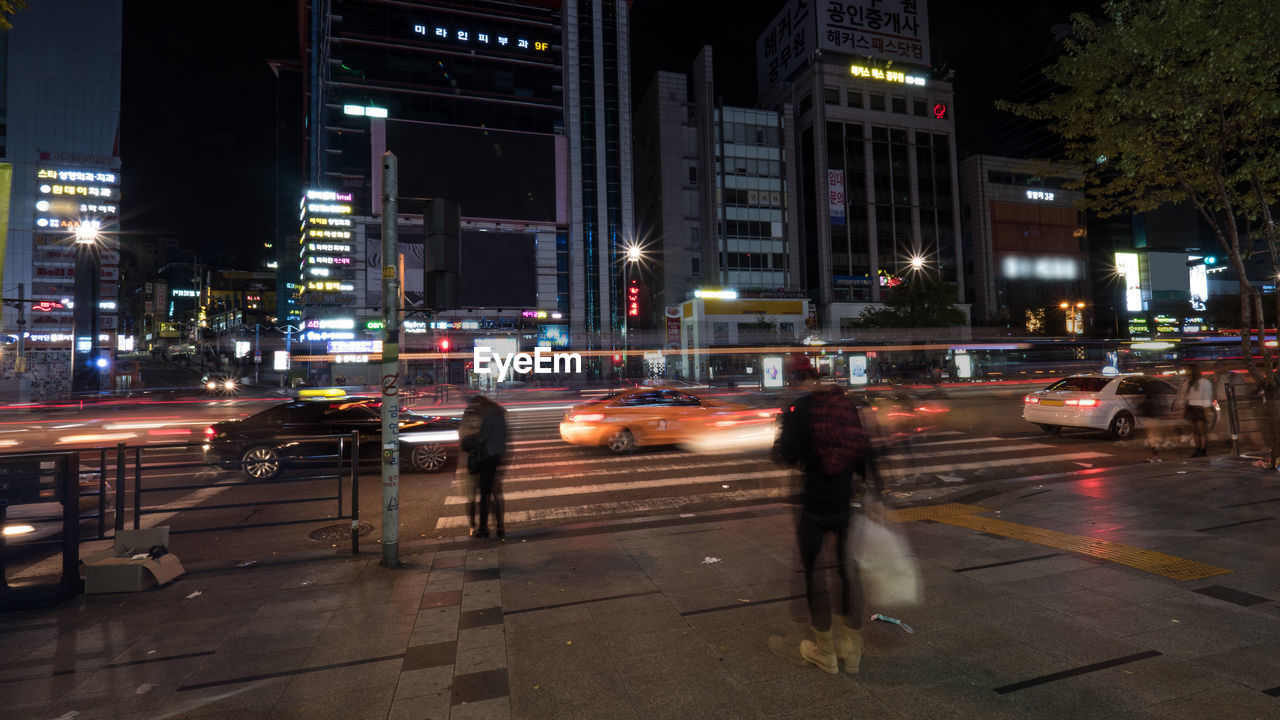 VIEW OF CITY STREET AT NIGHT