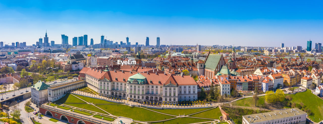 high angle view of cityscape against clear blue sky