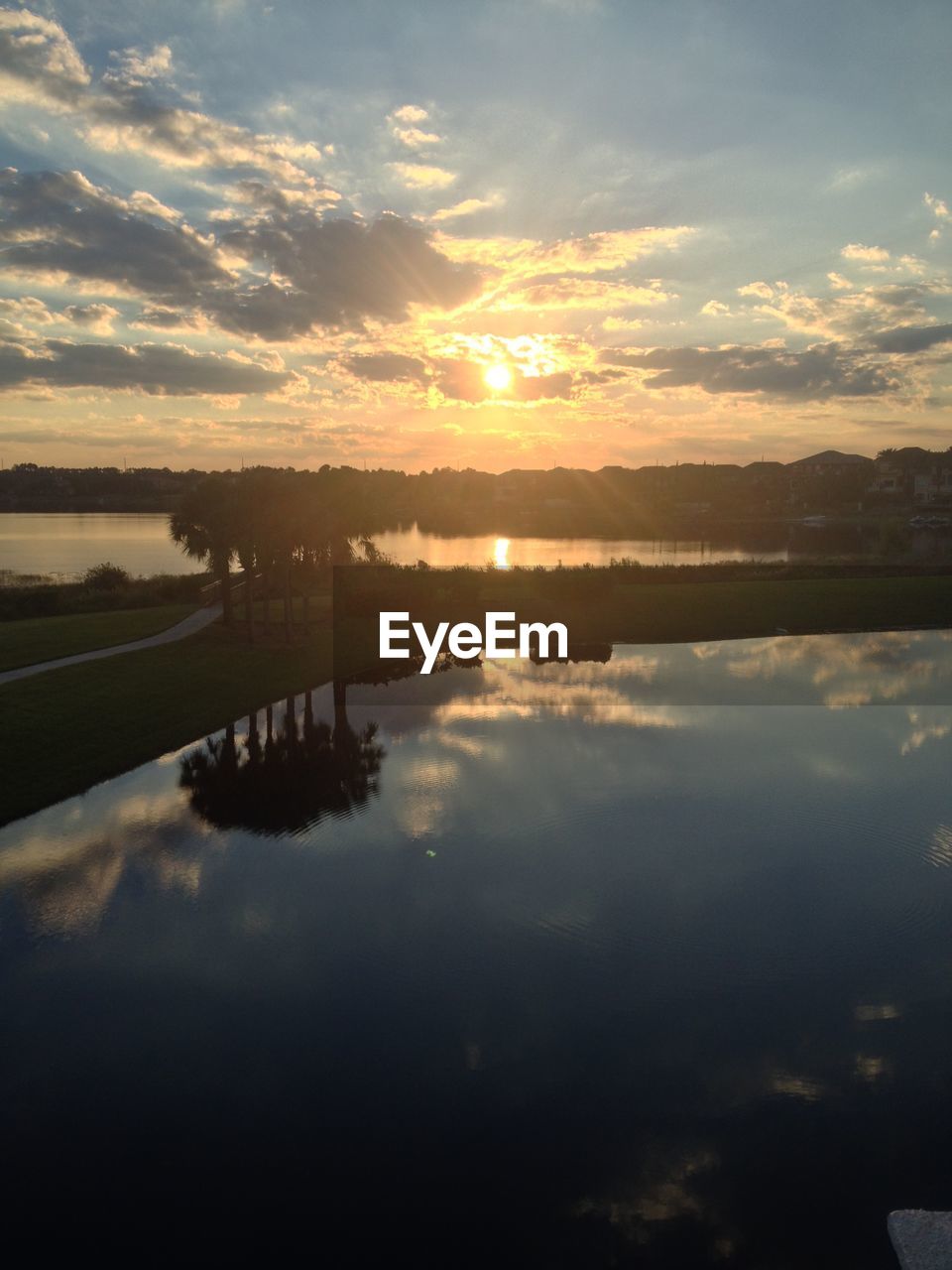 SCENIC VIEW OF LAKE AT SUNSET