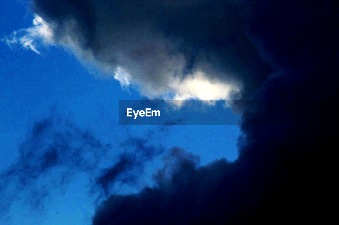 LOW ANGLE VIEW OF CLOUDS IN SKY OVER CLOUD