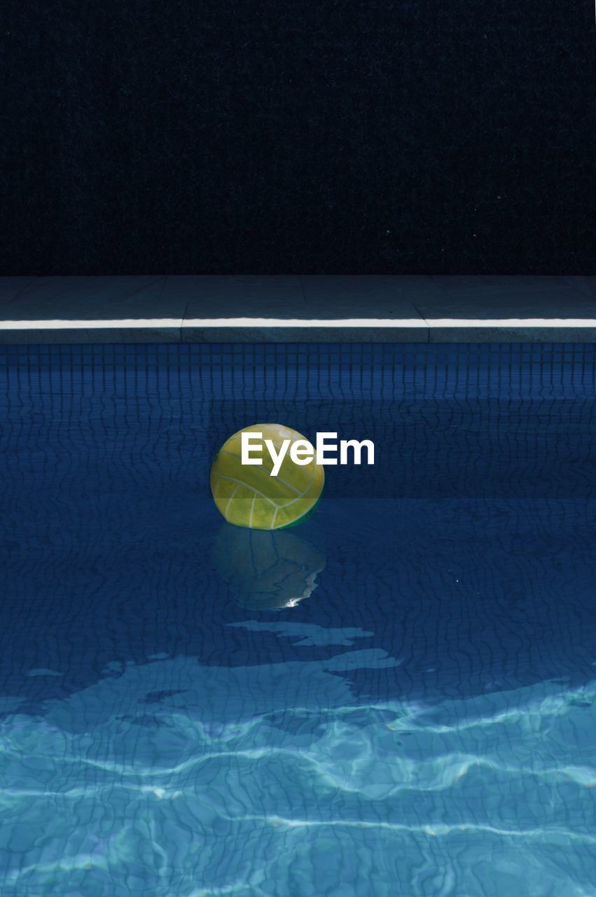 High angle view of beach ball floating on swimming pool