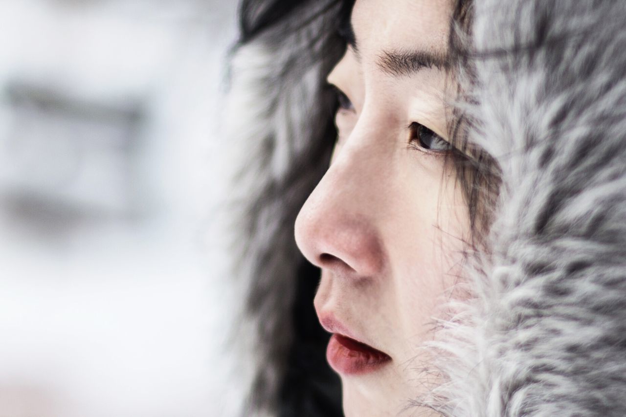 CLOSE-UP OF YOUNG WOMAN WITH EYES