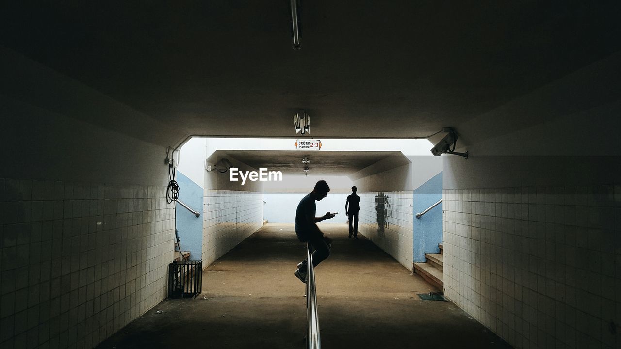 Man standing in corridor