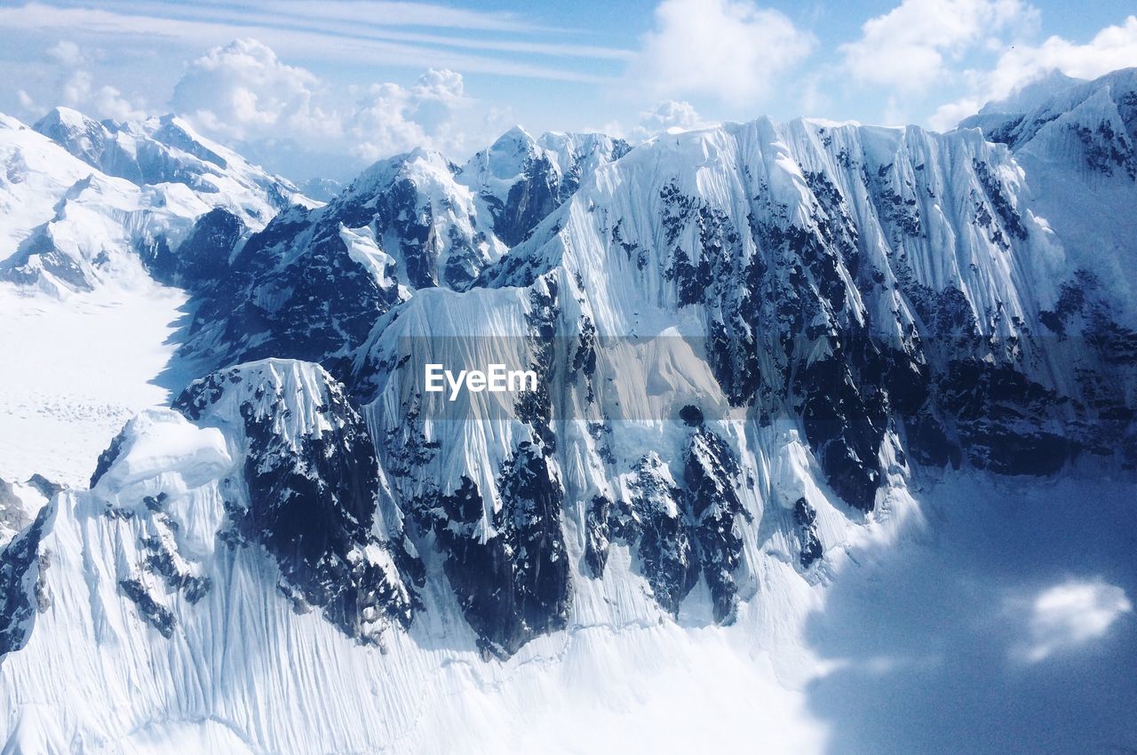 Panoramic view of snowcapped mountains against sky