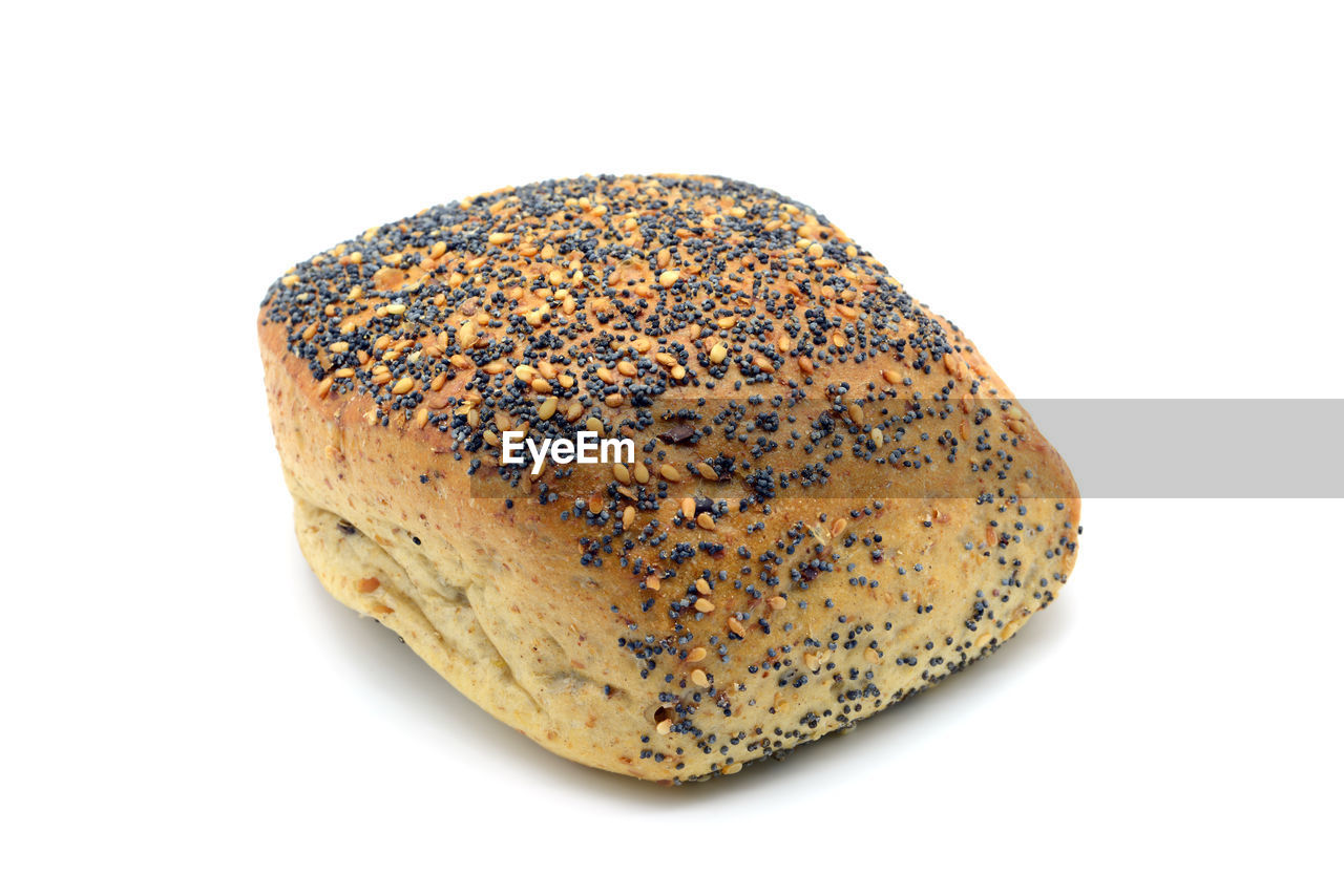 CLOSE-UP OF BREAD AGAINST WHITE BACKGROUND