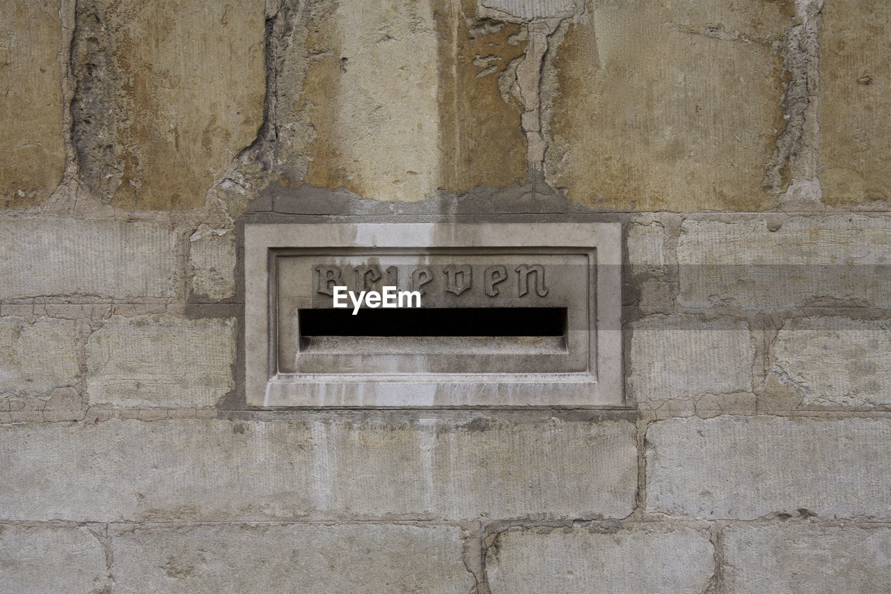 Letterbox slot on stone wall