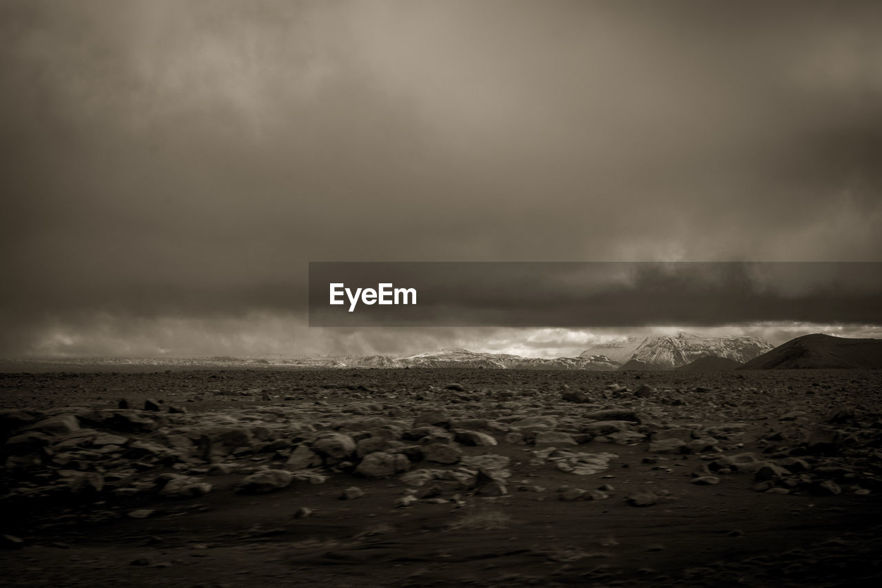 SCENIC VIEW OF STORM CLOUDS OVER SEA