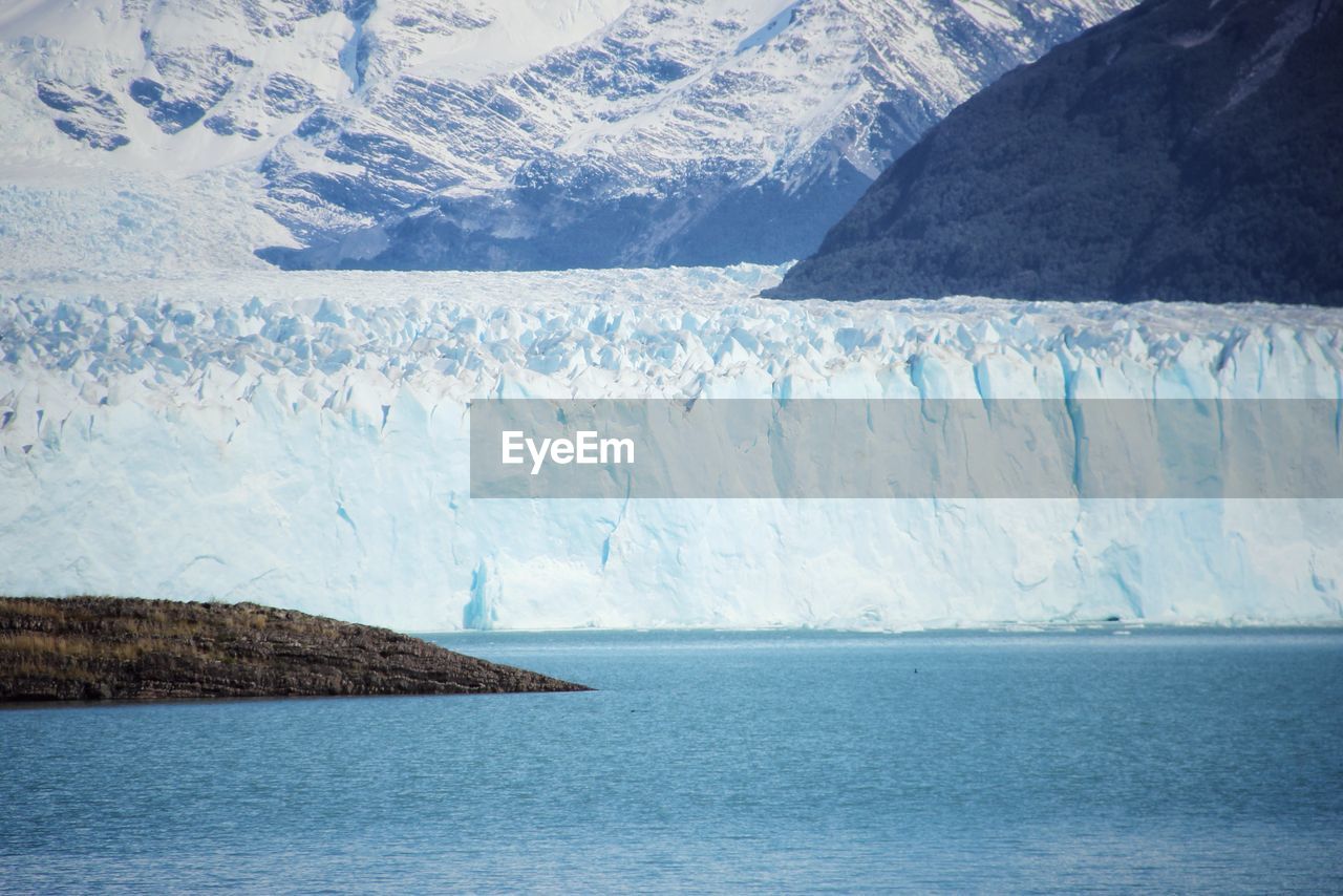 Scenic view of lake and glacier during winter