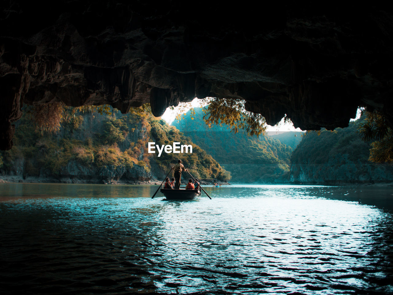 PEOPLE IN BOAT ON RIVER