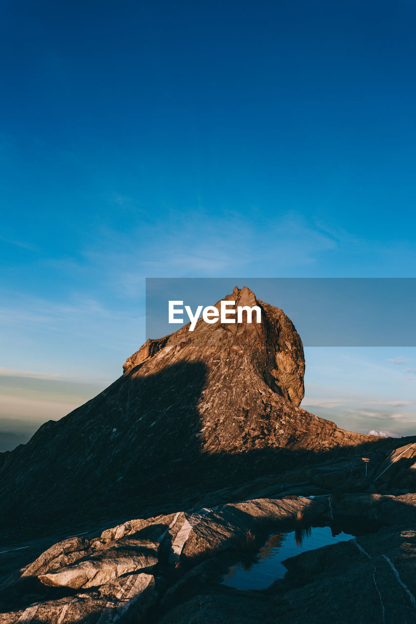 SCENIC VIEW OF ROCK FORMATION AGAINST SKY