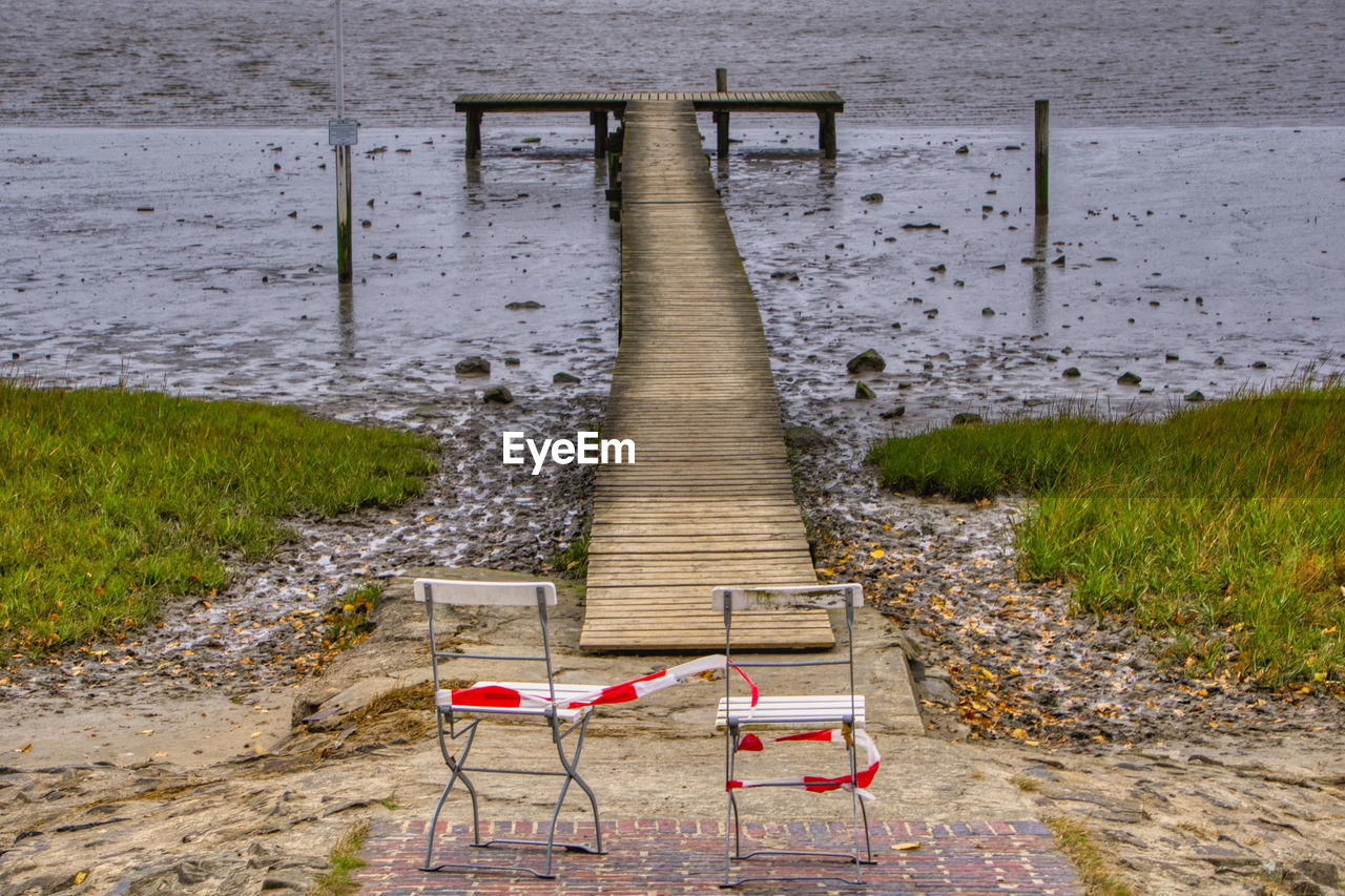 CHAIR ON FOOTPATH AT BEACH