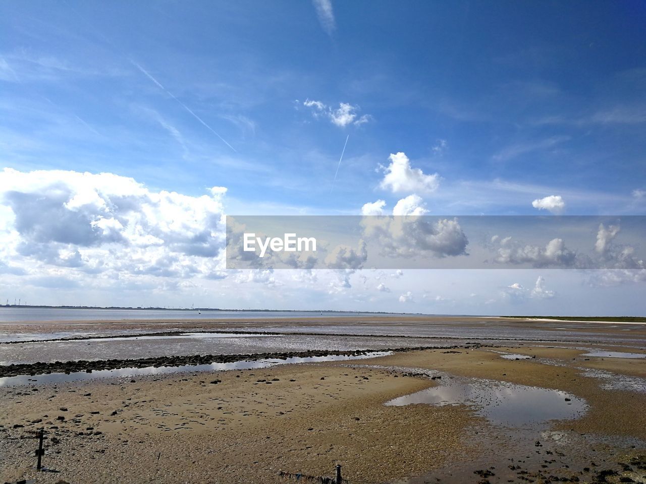 Scenic view of beach against sky