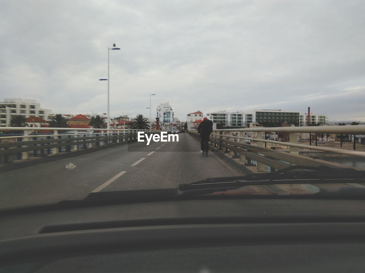 MAN MOVING ON ROAD IN CITY