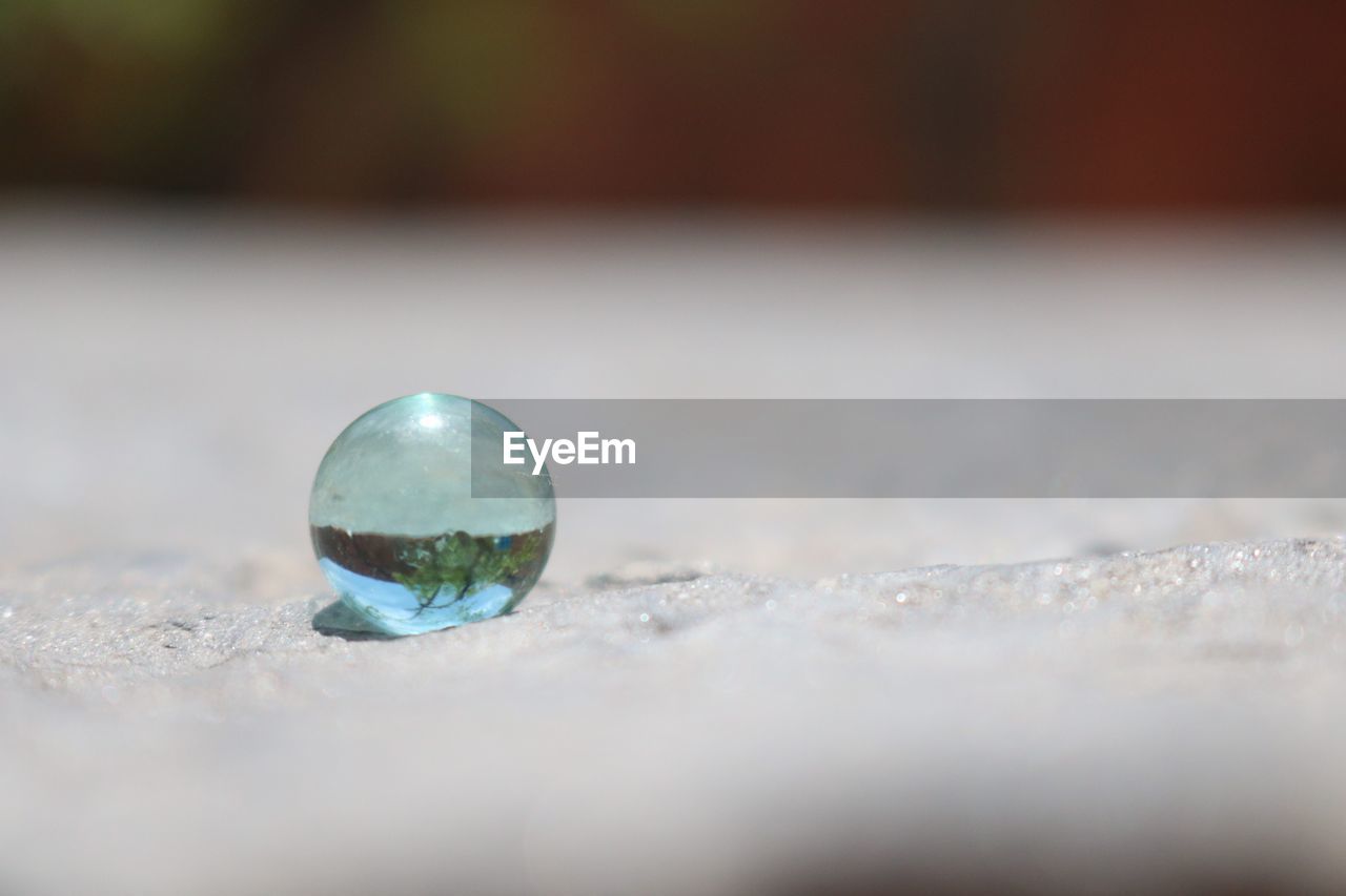 Extreme close-up of crystal ball on street