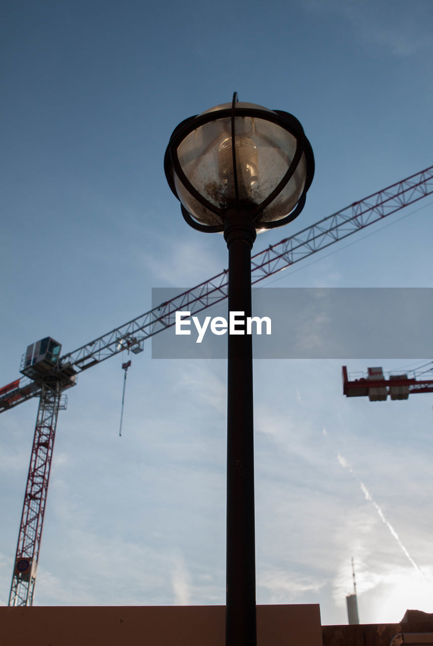 LOW ANGLE VIEW OF COMMUNICATIONS TOWER AGAINST SKY